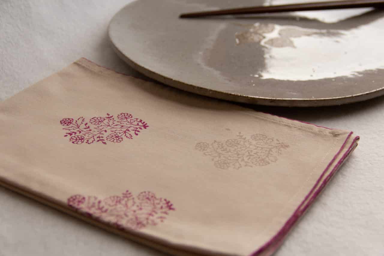 Napkin showing prints in the corner, and a dinner plate