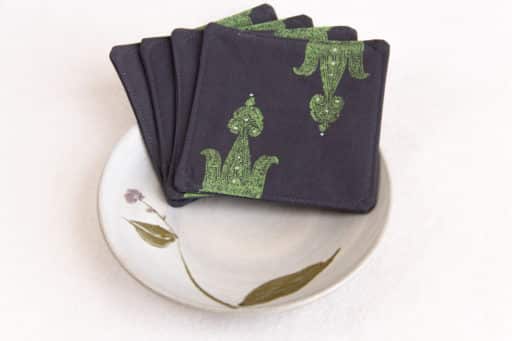 Sample Kokuin product image showing four woodblock printed fabric coasters inside a ceramic bowl.