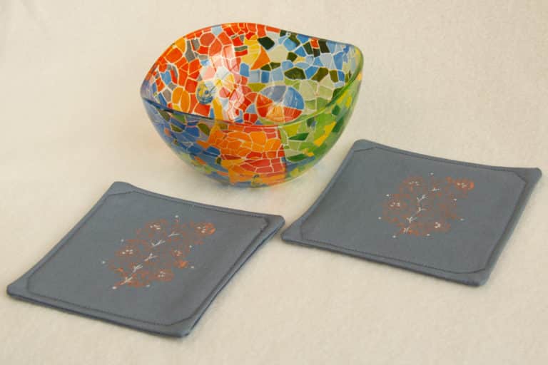 Two coasters with a glass bowl