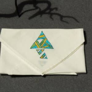 Folded handkerchief with colored triangle prints