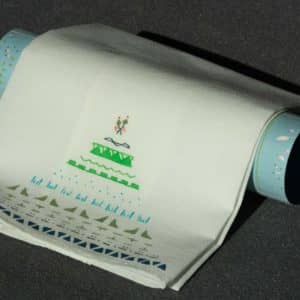 A folded handkerchief draped over a roll of gift-wrapping paper