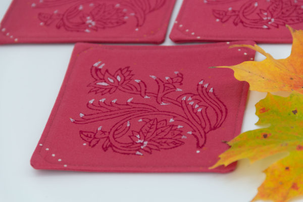 Close-up of one coaster and maple leaves