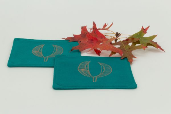 Two coasters with a sprig of oak leaves