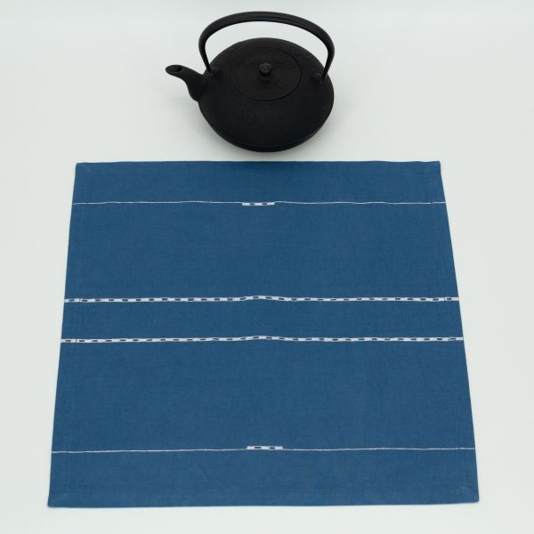 One napkin with a cast iron kettle