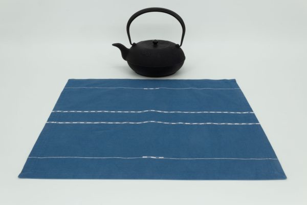 One napkin with a cast iron kettle