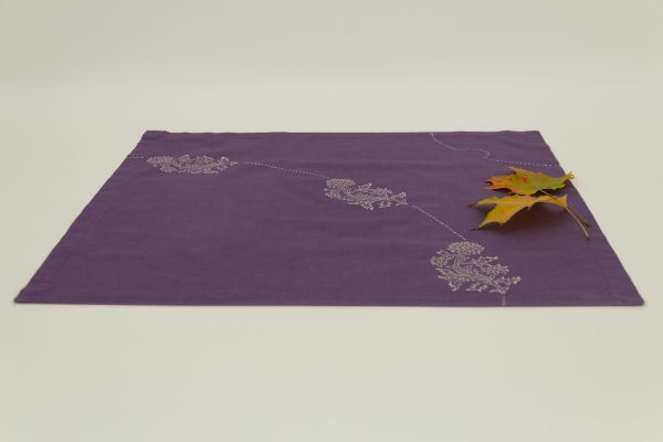 A single napkin with two maple leaves