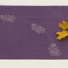A single napkin with two maple leaves